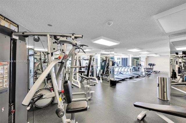 3530 Mystic Pointe Dr Unit 710, Aventura, FL 33180 - gym with a textured ceiling