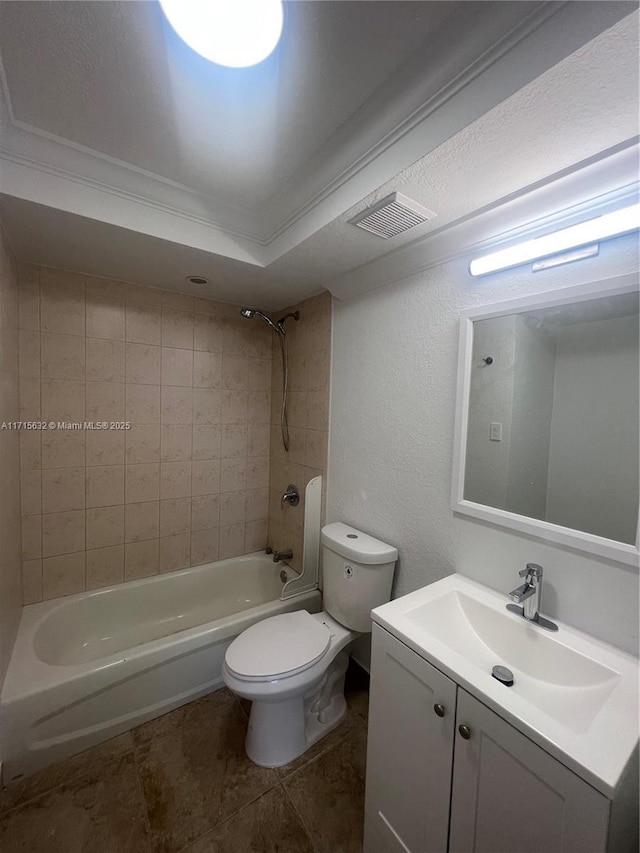 full bathroom with toilet, vanity, tiled shower / bath combo, and ornamental molding