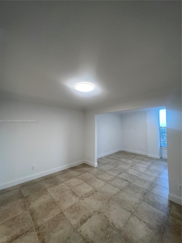 empty room with baseboards