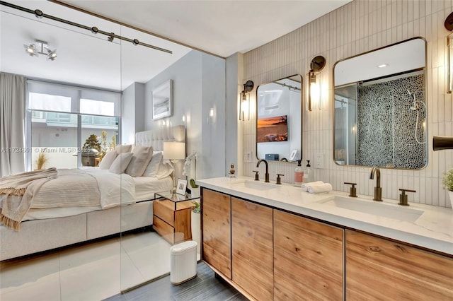 bedroom featuring tile patterned flooring and sink