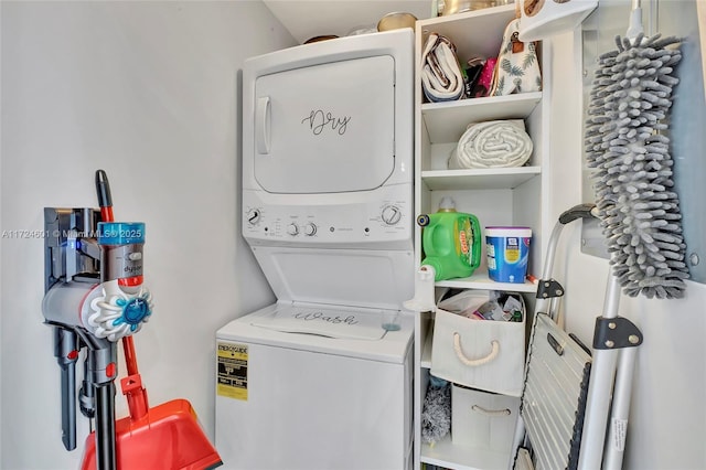 laundry area featuring stacked washing maching and dryer