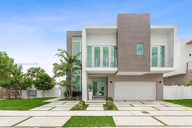 view of front facade featuring a garage and french doors