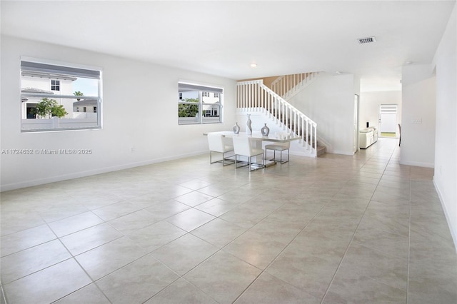 living room with light tile patterned flooring