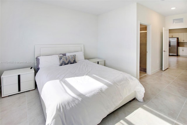 tiled bedroom with stainless steel fridge