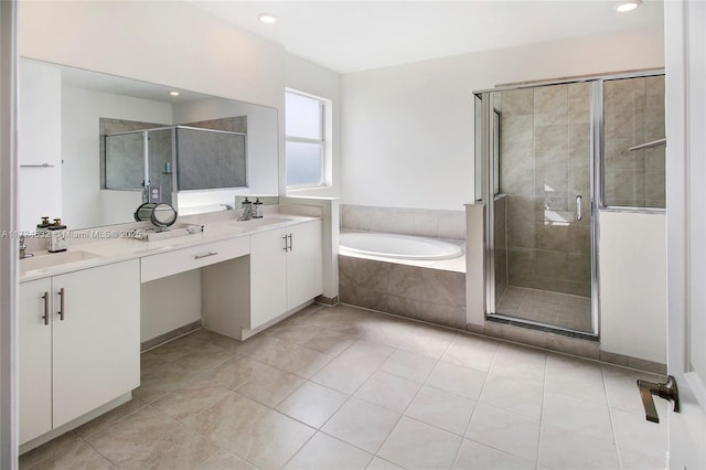 bathroom with tile patterned flooring, vanity, and separate shower and tub