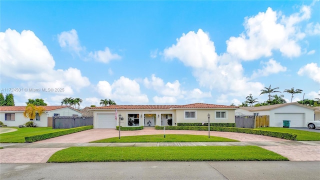 view of front of property with a garage and a front yard