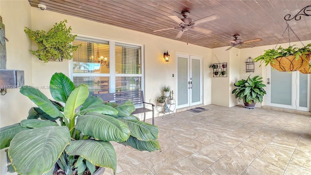 view of patio / terrace with french doors and ceiling fan