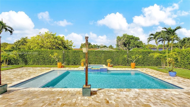 view of pool with an in ground hot tub and a patio area