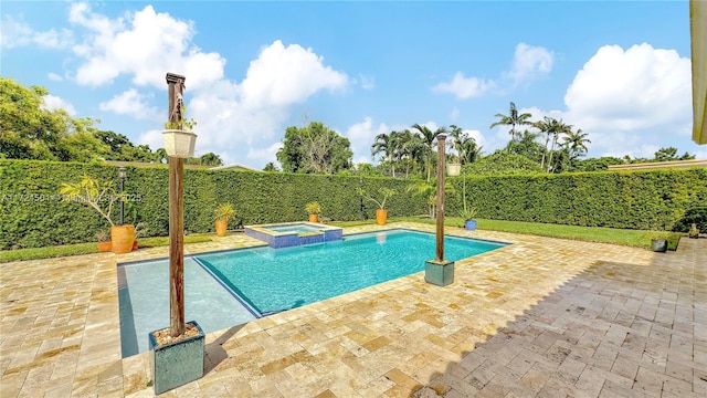 view of pool featuring an in ground hot tub and a patio