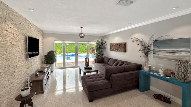 living room with a textured ceiling and crown molding