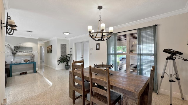 dining space featuring a chandelier and ornamental molding