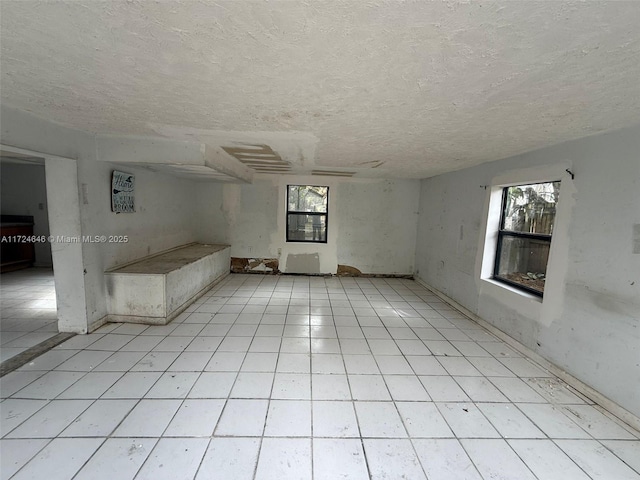 empty room featuring a textured ceiling