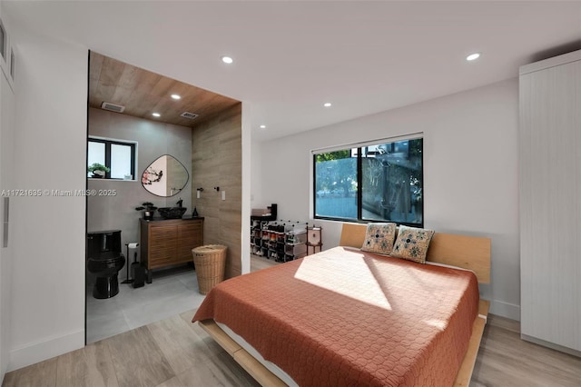 bedroom with light hardwood / wood-style floors