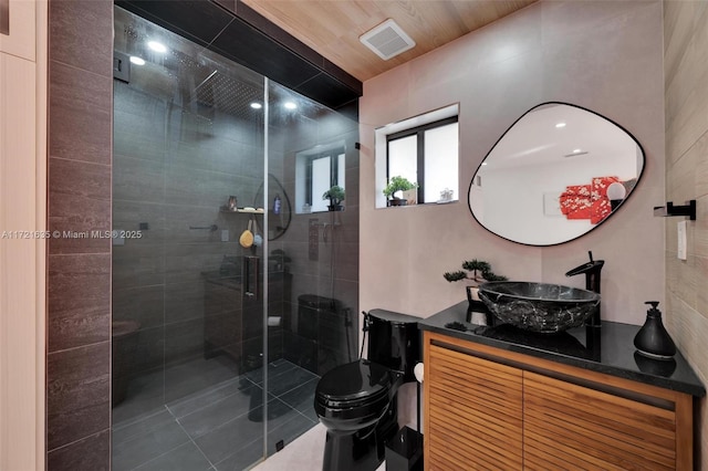 bathroom featuring vanity, toilet, a shower with shower door, and wooden ceiling