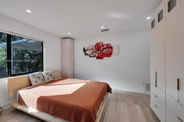 bedroom with light wood-type flooring