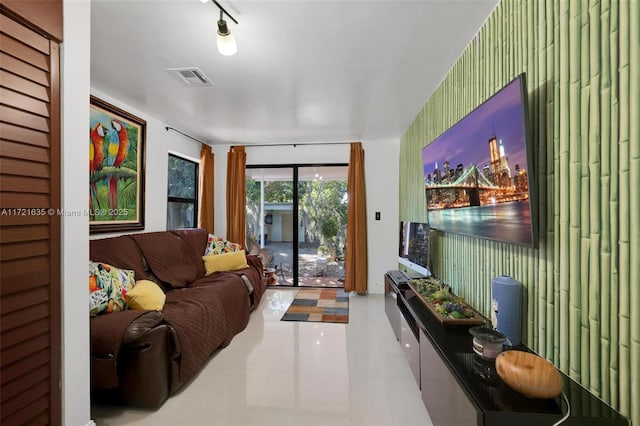 tiled living room with rail lighting