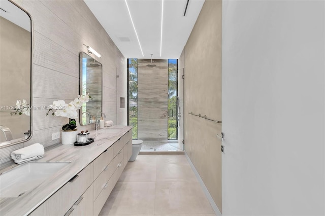 bathroom with tile patterned floors, vanity, and toilet