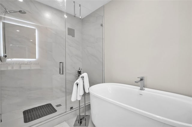 bathroom with sink and shower with separate bathtub