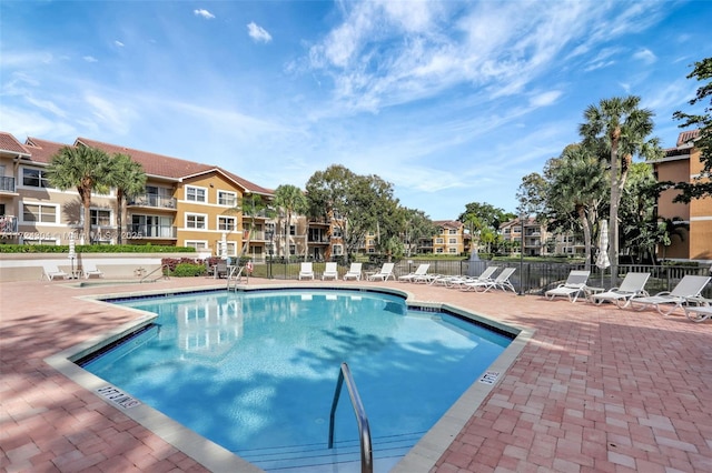 view of swimming pool with a patio