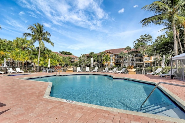 view of swimming pool featuring a patio area