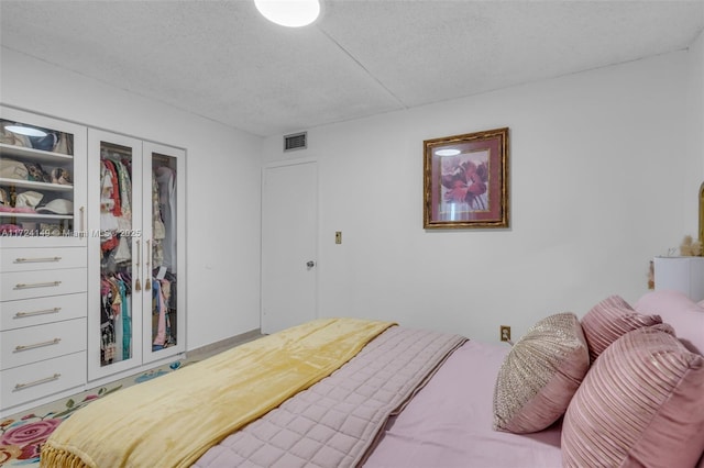 bedroom featuring a textured ceiling