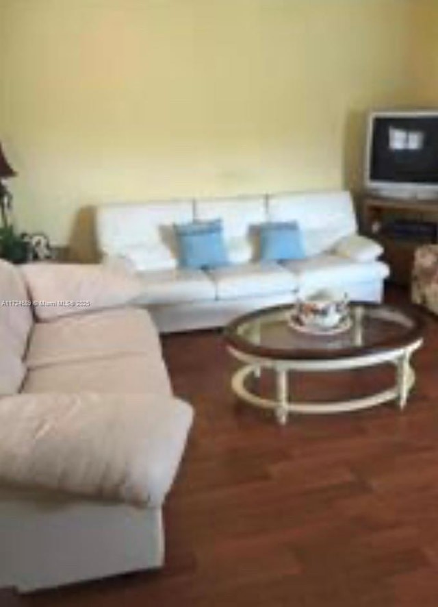 living room with dark hardwood / wood-style floors