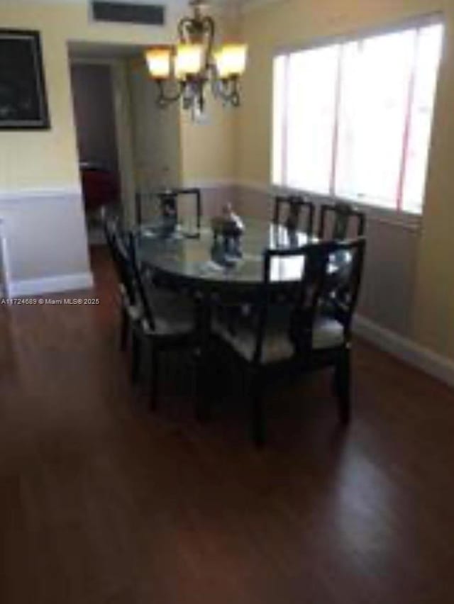 dining room featuring a chandelier