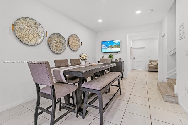 dining area with light tile patterned floors