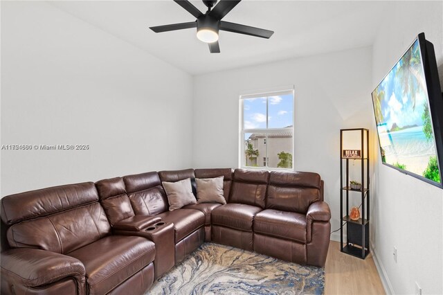 living room featuring ceiling fan and light hardwood / wood-style floors