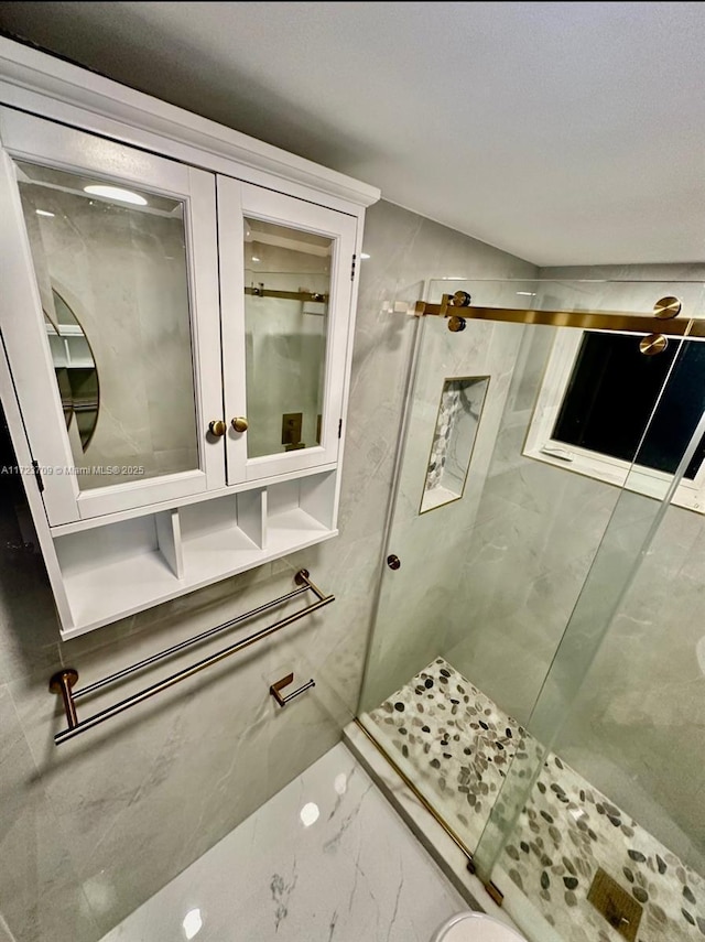 bathroom featuring an enclosed shower