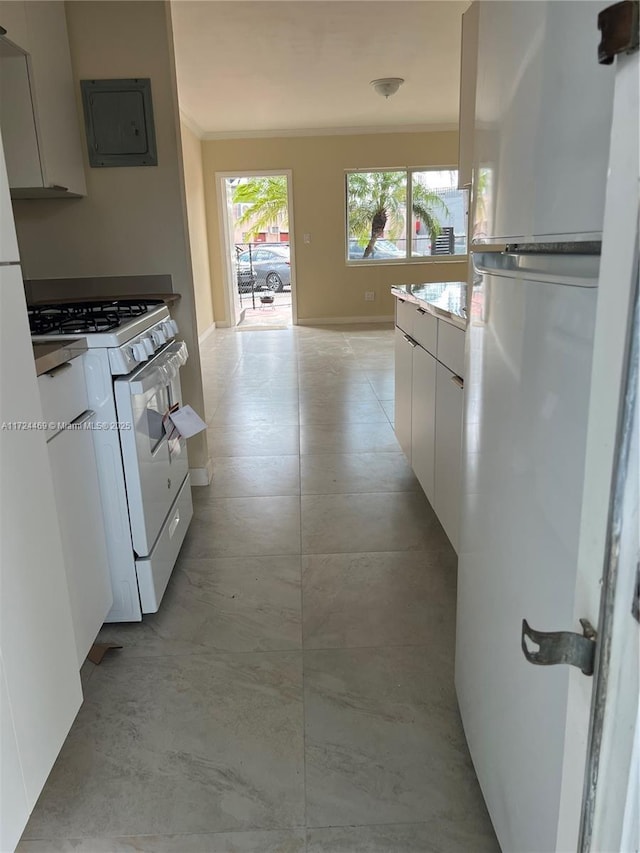 kitchen featuring white cabinets, white appliances, crown molding, and electric panel