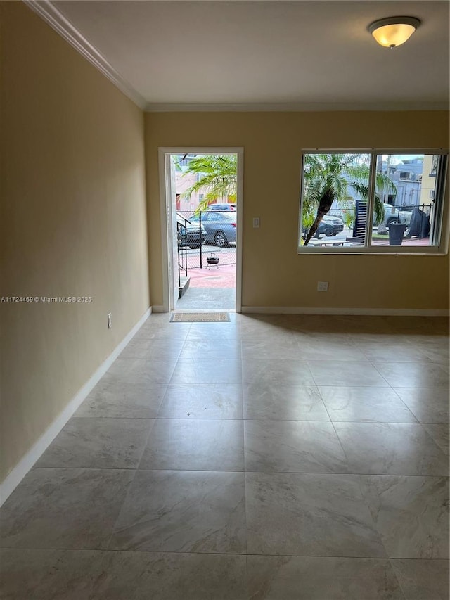 empty room featuring ornamental molding