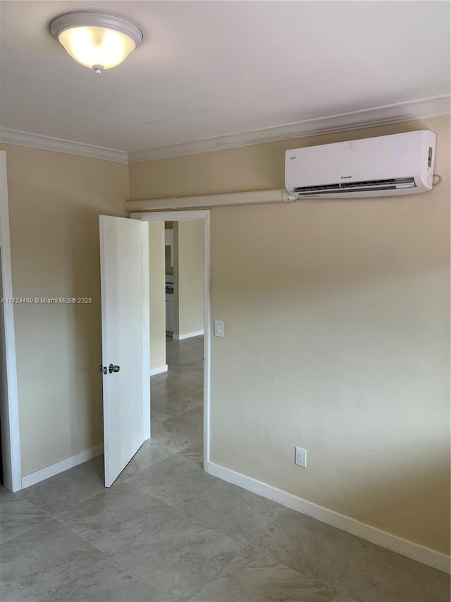 unfurnished room with crown molding and a wall mounted air conditioner