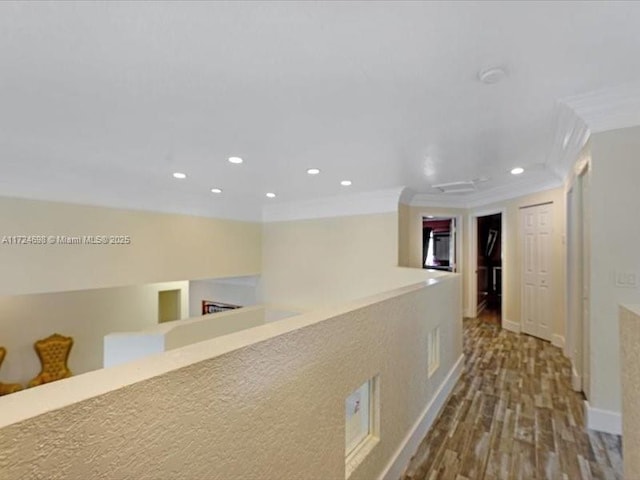 hallway featuring crown molding and hardwood / wood-style floors