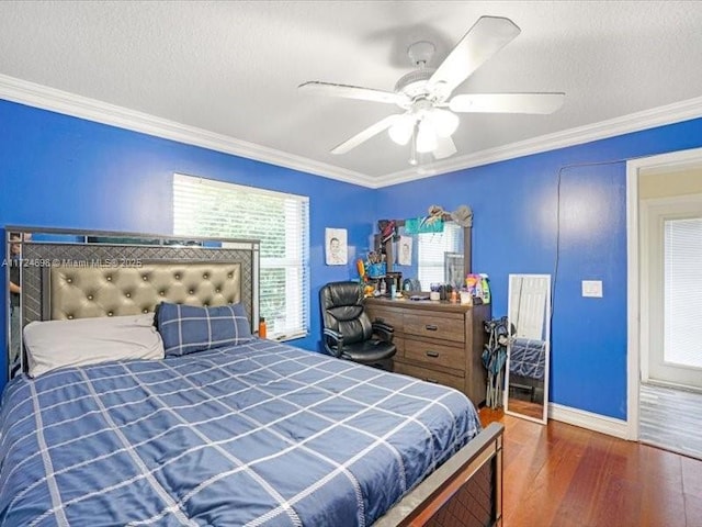 bedroom featuring a textured ceiling, ceiling fan, dark hardwood / wood-style flooring, and crown molding