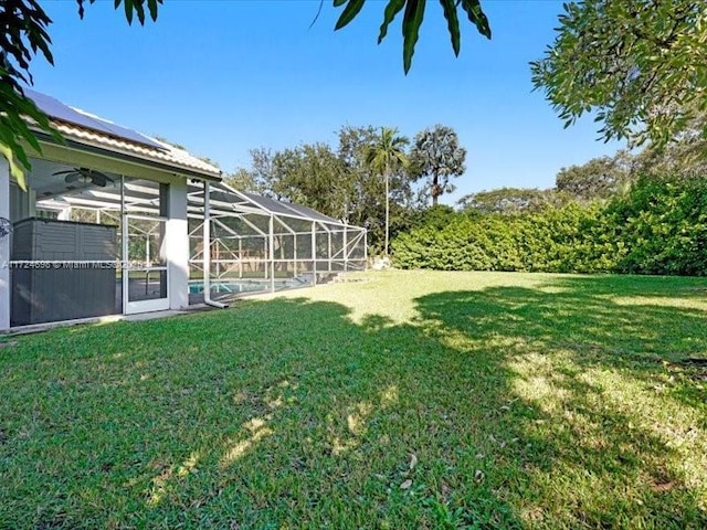 view of yard with a lanai