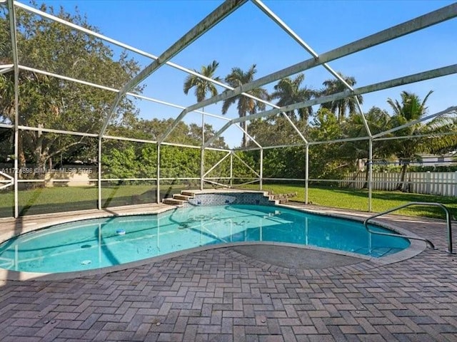 view of swimming pool with a lanai and a patio