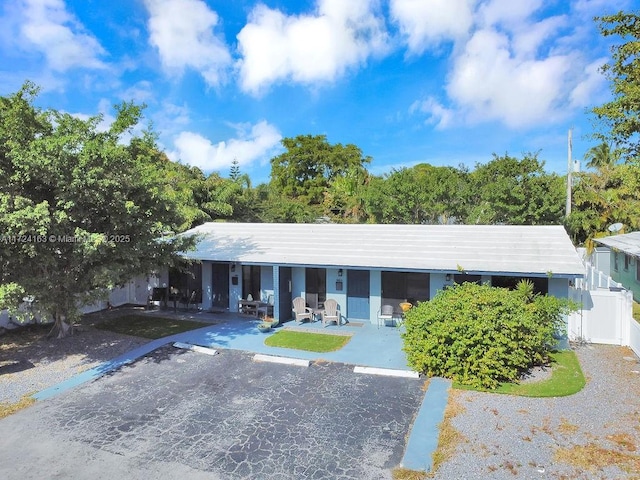 single story home featuring a patio