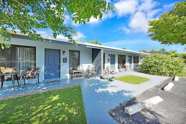 single story home featuring a patio area