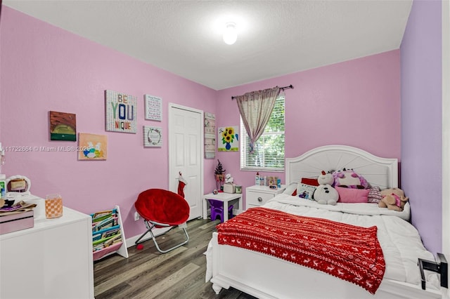 bedroom featuring dark hardwood / wood-style flooring