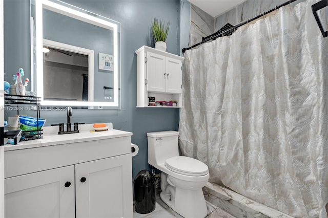 bathroom with walk in shower, vanity, and toilet