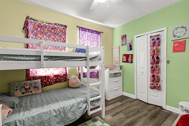 bedroom featuring dark hardwood / wood-style flooring, a closet, and ceiling fan