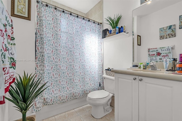 full bathroom featuring tile patterned floors, vanity, toilet, and shower / bath combo with shower curtain