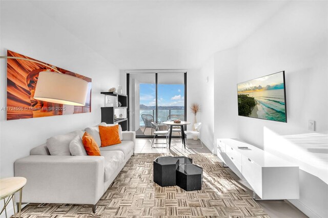 tiled living room with expansive windows