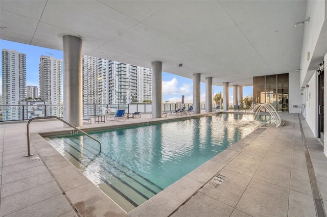 view of pool with a community hot tub