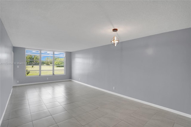 spare room with light tile patterned flooring