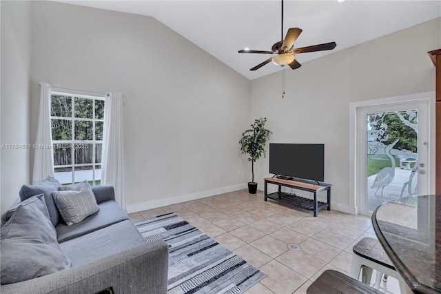 living room with ceiling fan, light tile patterned floors, and high vaulted ceiling