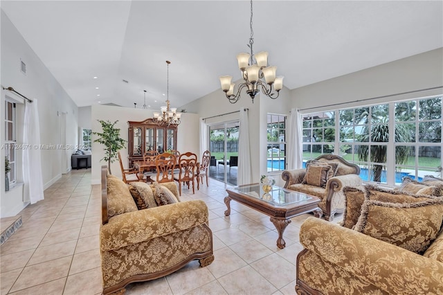 living room with an inviting chandelier, light tile patterned floors, and lofted ceiling