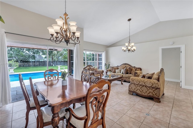 dining space featuring vaulted ceiling, light tile patterned flooring, and a notable chandelier