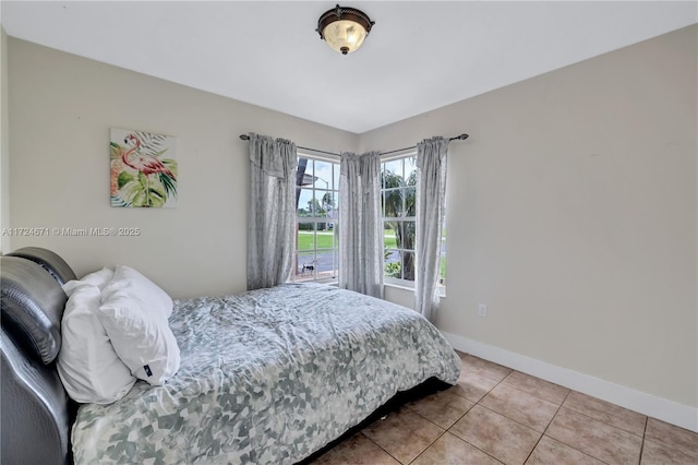 bedroom with light tile patterned flooring